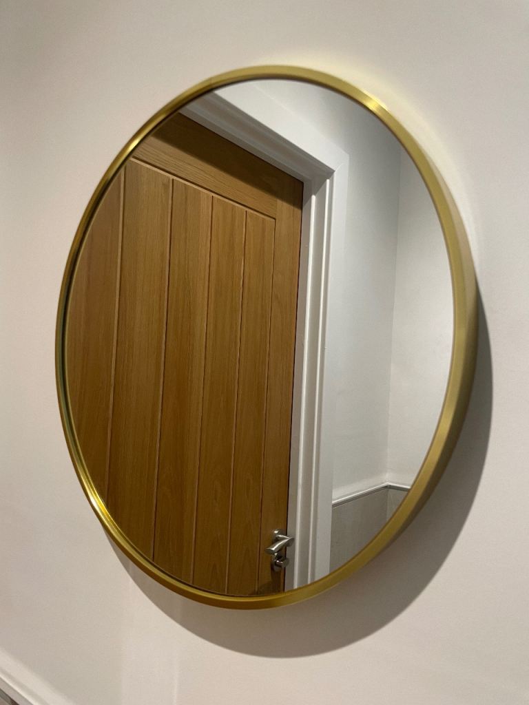 Gold round mirror
