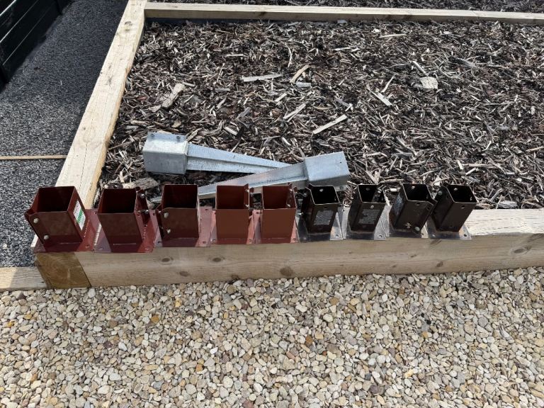 Fence post bolt down and spikes