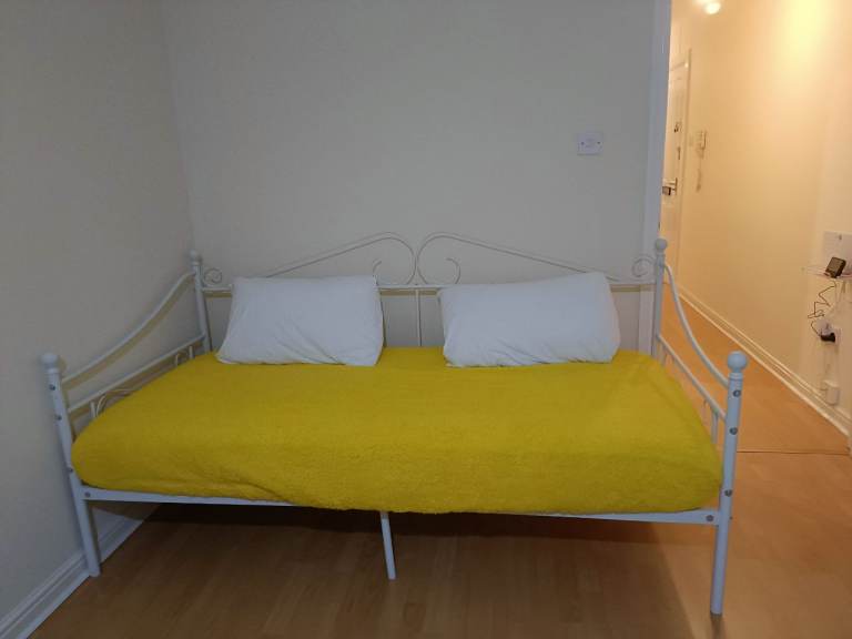 Sofa bed frame with mattress, covers and pillows