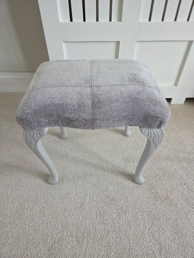 Grey upholstered stool 