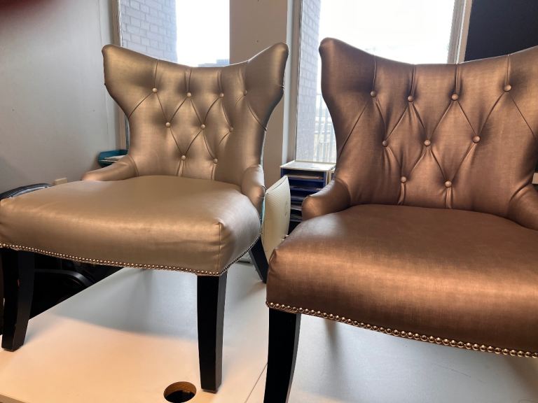 Leather like and velour chesterfield style armchairs