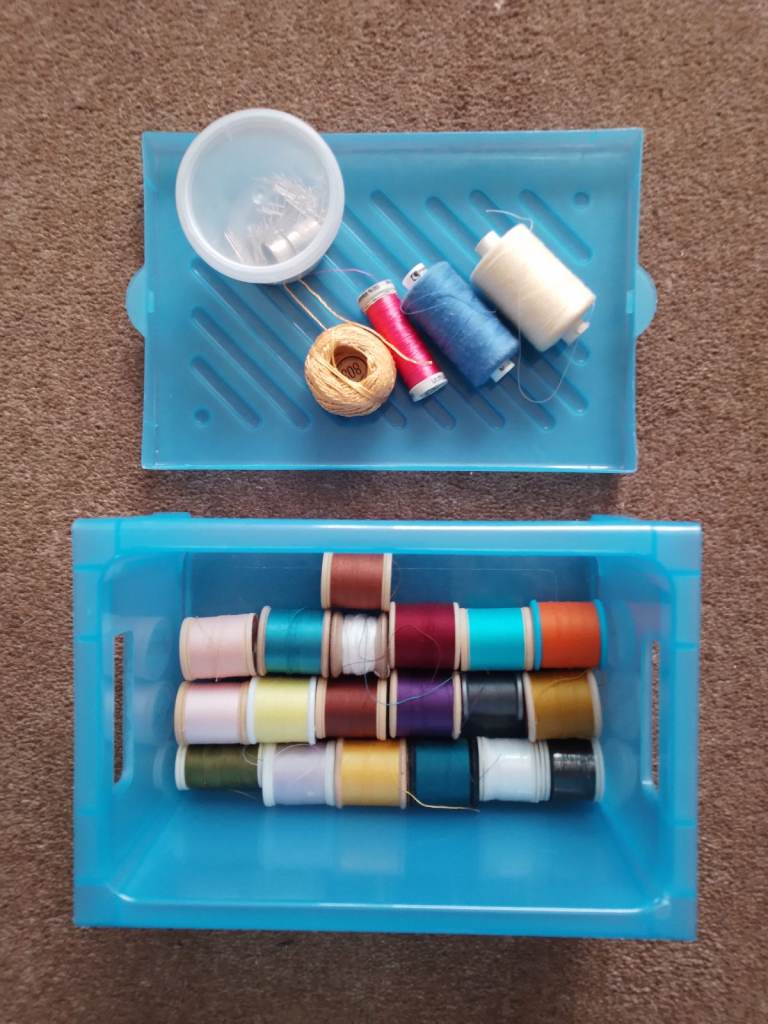 SEWING BOX with selection of cotton reels, box of pins and 2 thimbles.