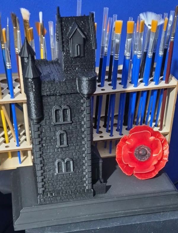 Ulster Tower with poppy on plinth 
