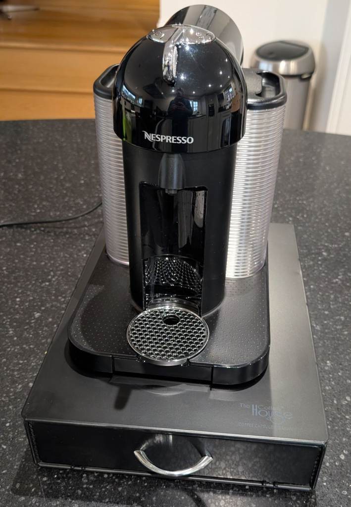 Nespresso Vertuo Coffee Machine, Black. Like new comes with coffee capsule dispenser.
