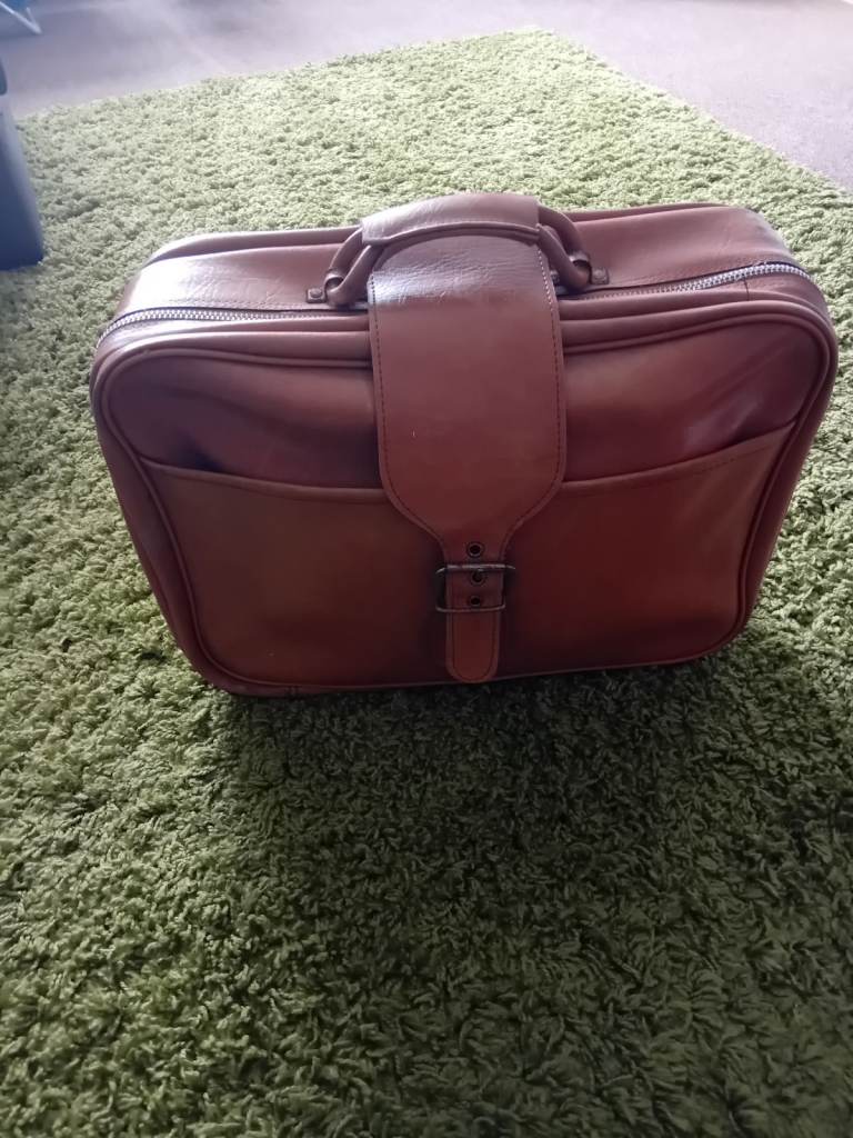 Vintage travel suitcase and holder