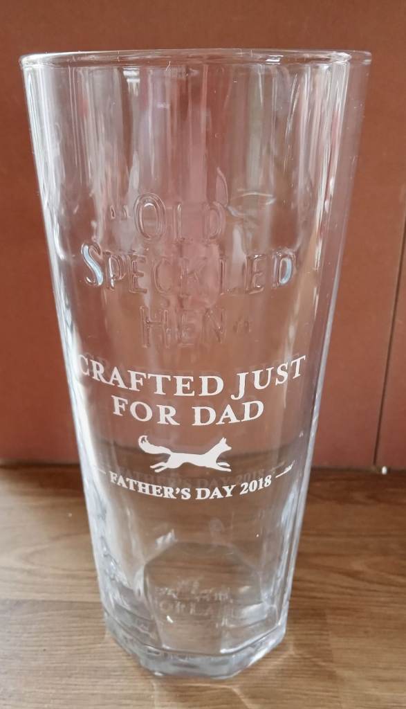 Old Speckled Hen pint beer glass special edition. Brand new. Etched with “crafted just for dad”