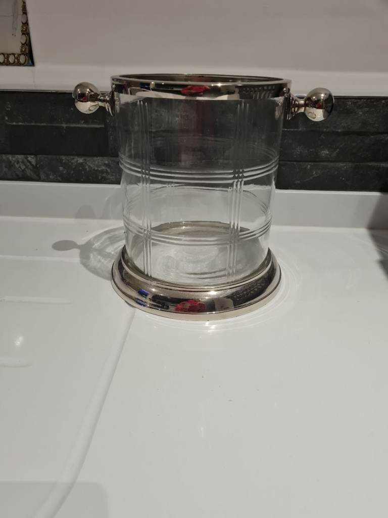 Glass and silver ice bucket