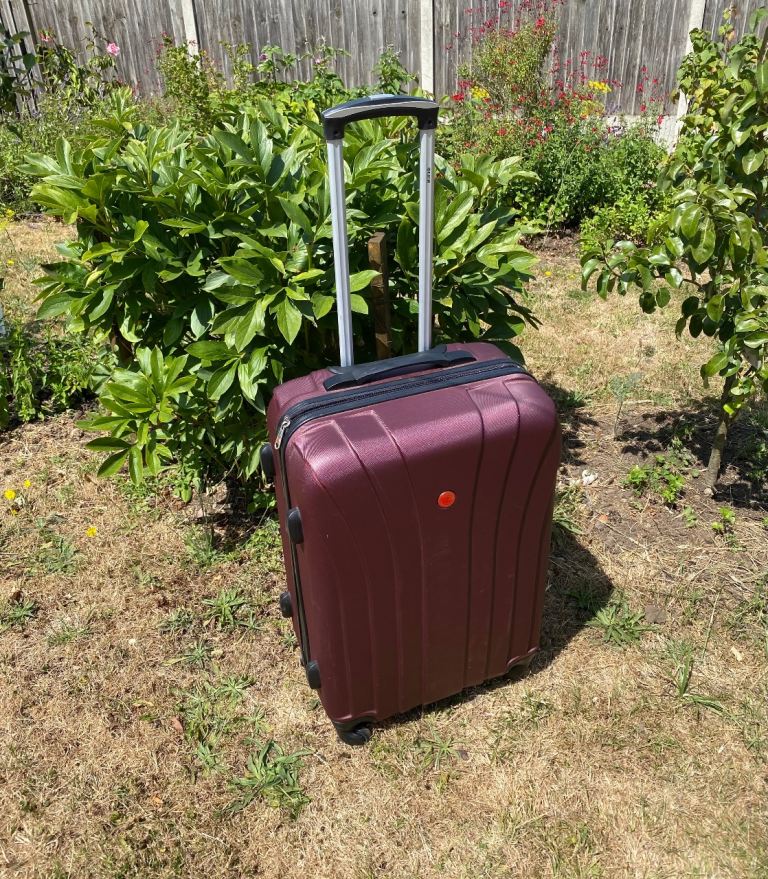 Maroon Hard-Shell Suitcase with Wheels – Good Condition