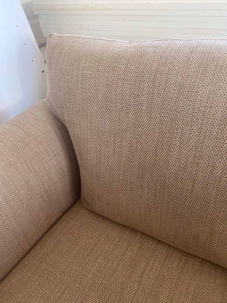 Two seater cream sofa