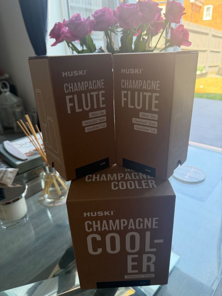 Brand new HUSKI Champagne cooler set with 2 flutes in the black colour