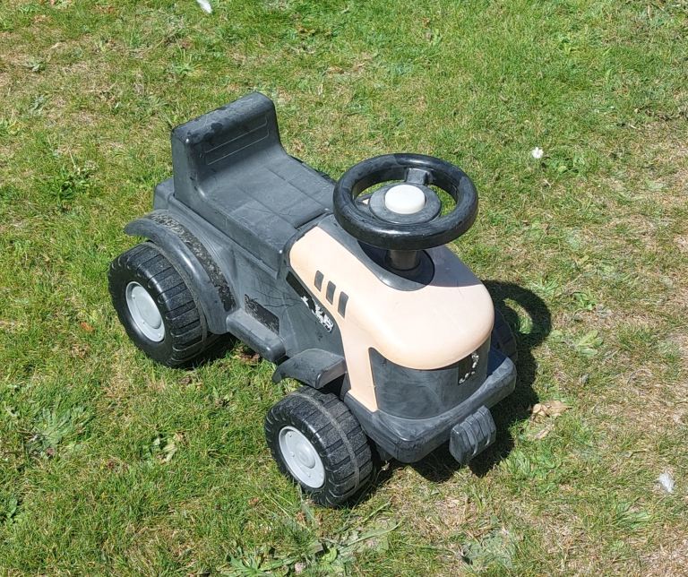 Kids Ride-On Tractor Toy – Black and Beige, Good Condition