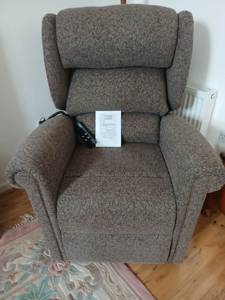 Almost new dual motor riser recliner 