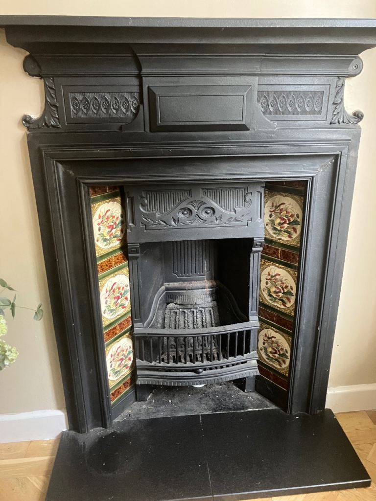 Good Condition Antique Cast Iron Fireplace with Decorative Tiles