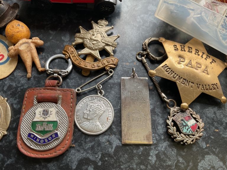 Coat badges and small toy cars
