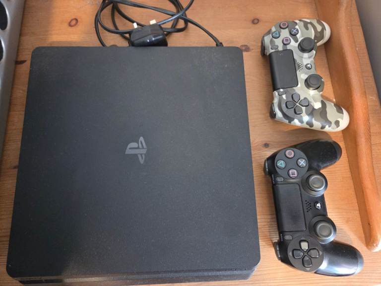 Sony PlayStation 4 with Two Controllers – Good Condition