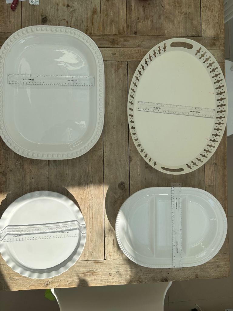 Set of four white platters 