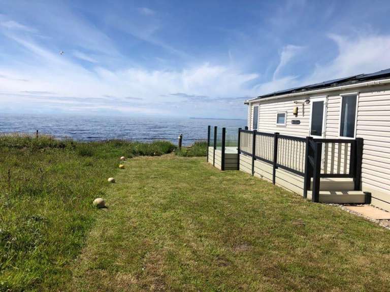 LAND WITH CARAVAN - SPECTACULAR LOCATION IN KINTYRE (WEST COAST SCOTLAND)