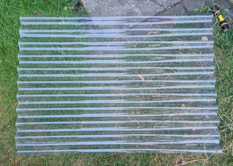 1 x Corrugated clear plastic section in used condition. Upcycling, reuse.