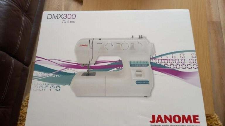 Brand New Janome DeLuxe Sewing Machine DMX300 Singer