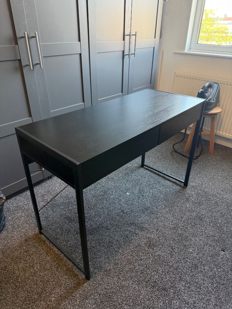 Black desk with brown leather chair 