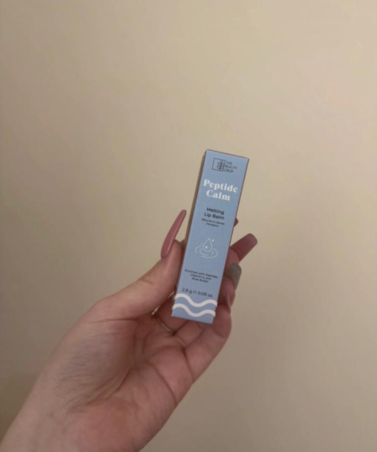 Peptide calm melting lip balm in shade iced latte 