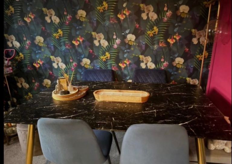 Dining room table black marble style top and gold legs 