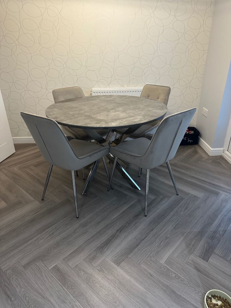 Grey marble effect glass top dining table with chrome legs and 4 grey suede dining chairs 
