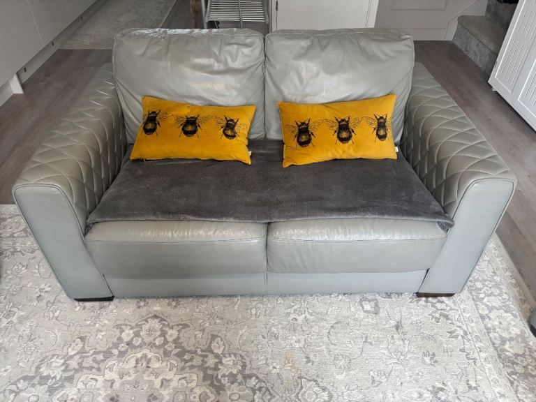 Two seater grey leather sofa