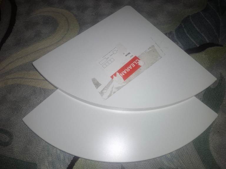 Pair of white corner shelves