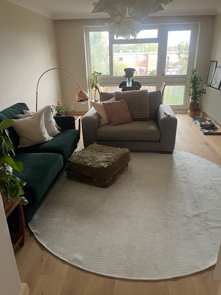 Large Round cream low pile rug 