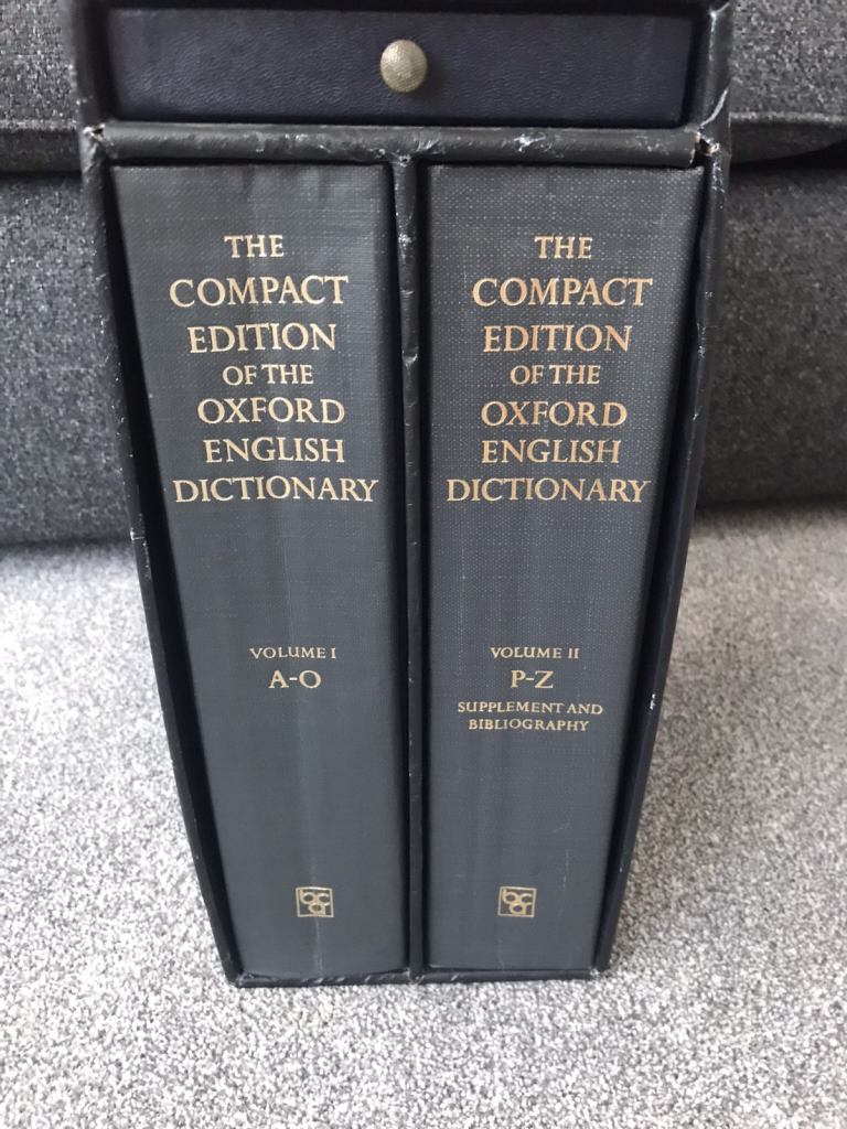 Compact Edition of the Oxford English Dictionary and magnifying glass