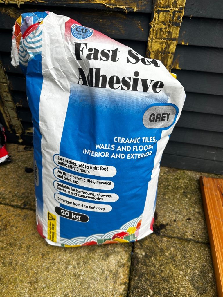 Grey floor tile adhesive 