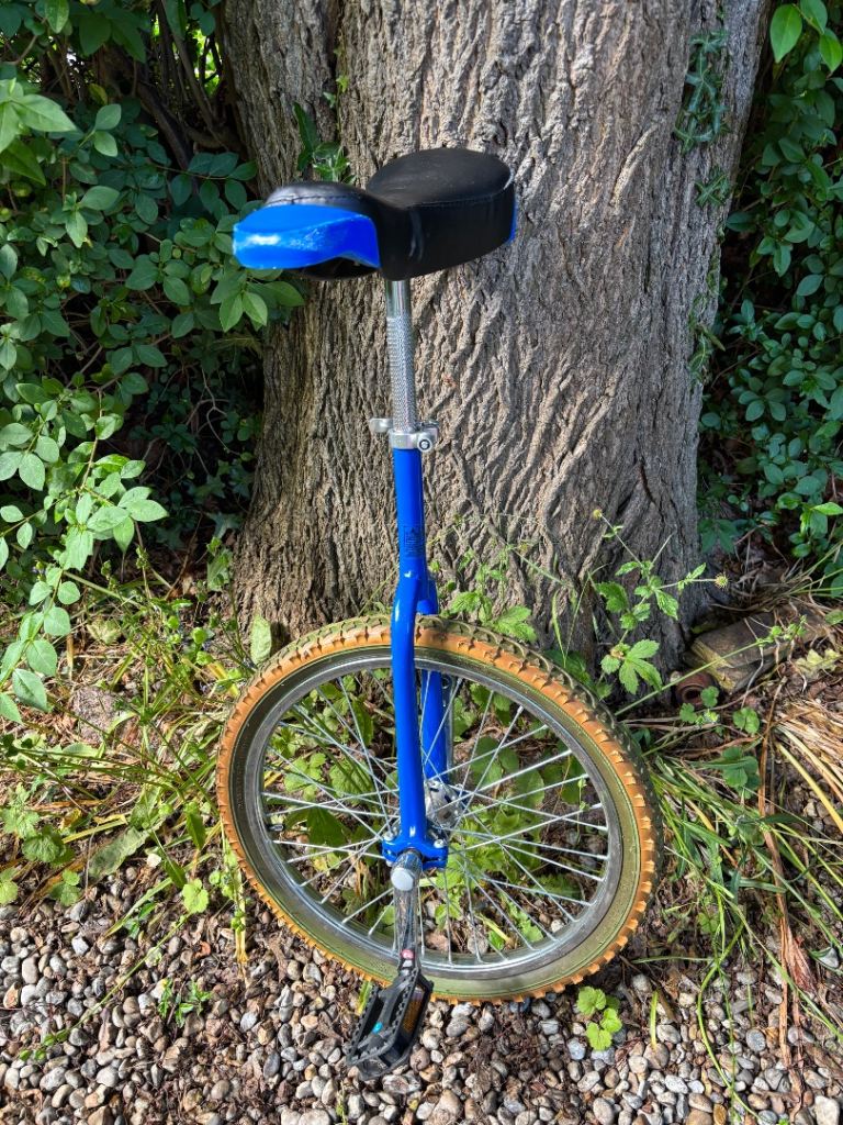 Unicycle with blue frame and black/blue seat for 12+