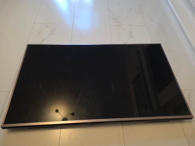 Large TV Screen - Faulty Display, Needs Repair