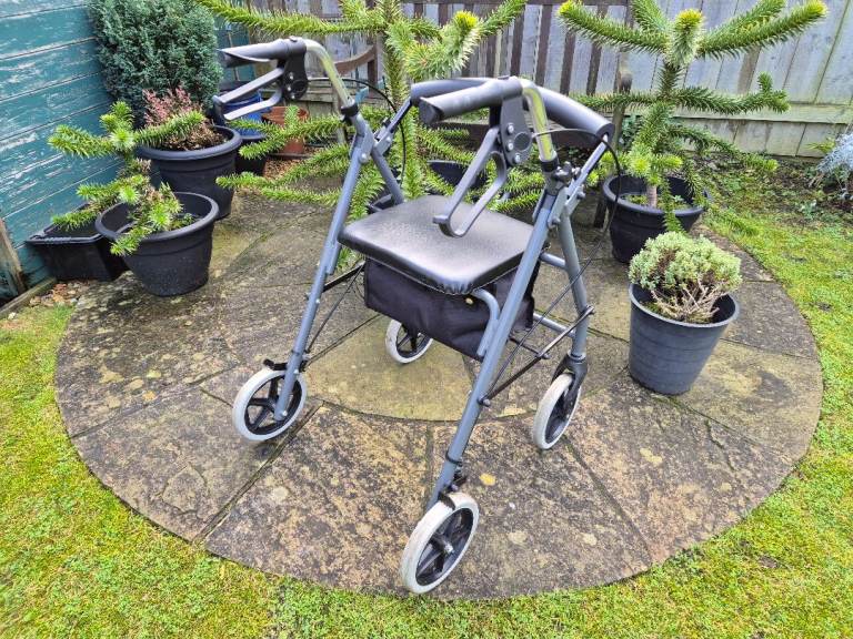 AS NEW, Rollator Walker Stroller Mobility Disability Walking Aid. 4 Wheels, Brakes, Seat, Bag