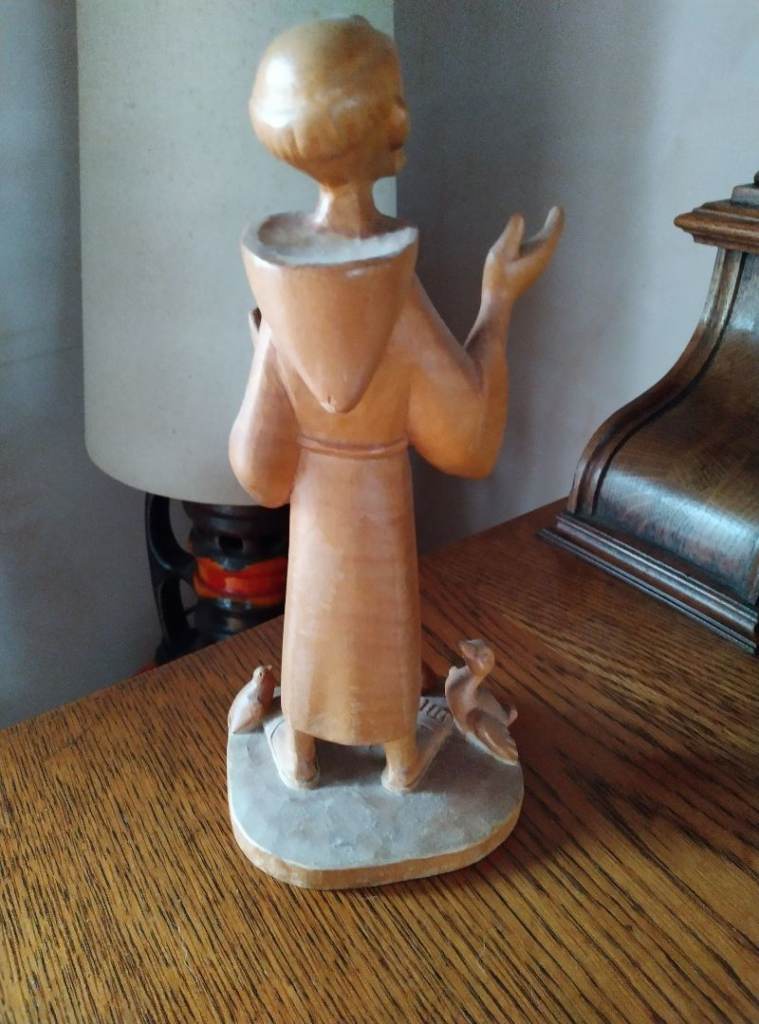 Wooden Seated angel and singing monk