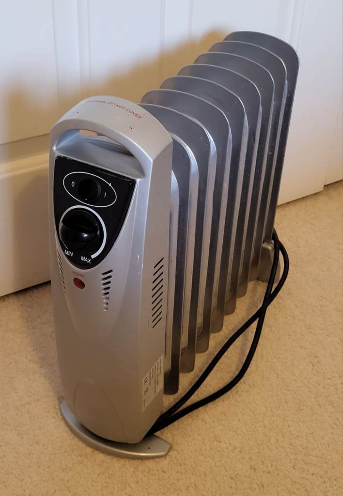 SMALL SILVER COLOURED OIL FILLED RADIATOR 
