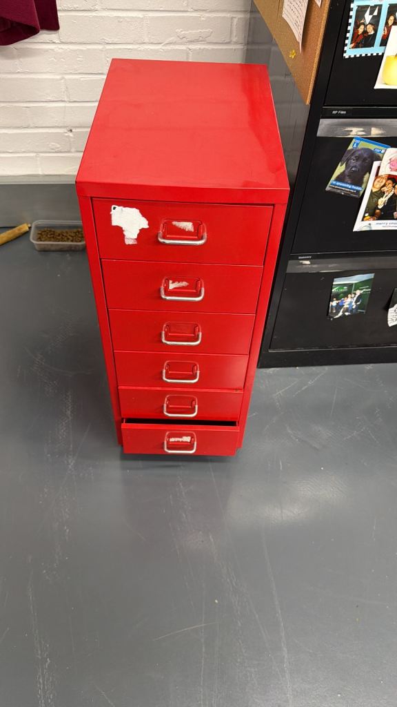 Red filing cabinet on wheels 