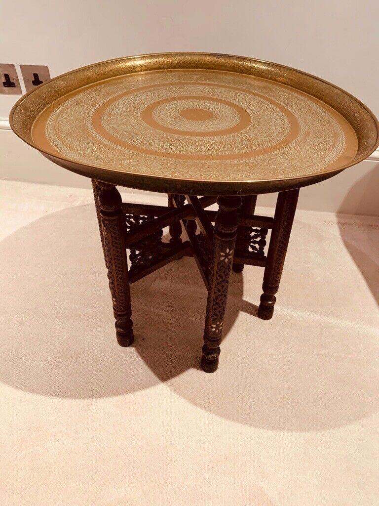 Antique middle-eastern brass tray on folding stand