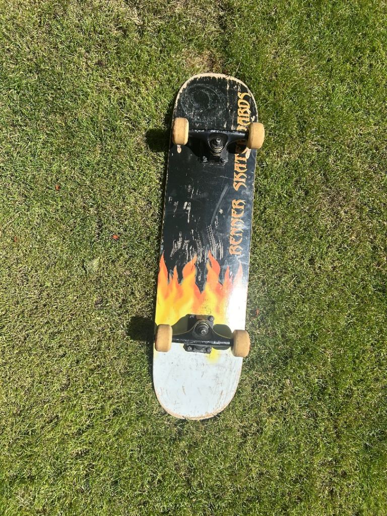 Used Skateboard with Flame Design – Fair Condition