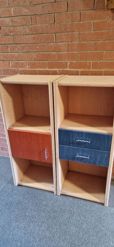Three Wooden Storage Units with Drawers and Cupboards