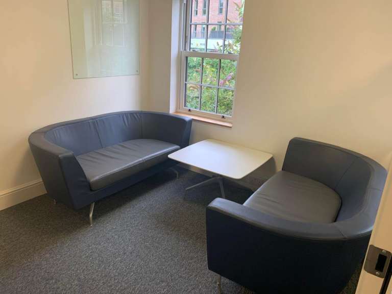 Twin matching set of Orangebox Cwtch navy blue and contrast grey leather sofas