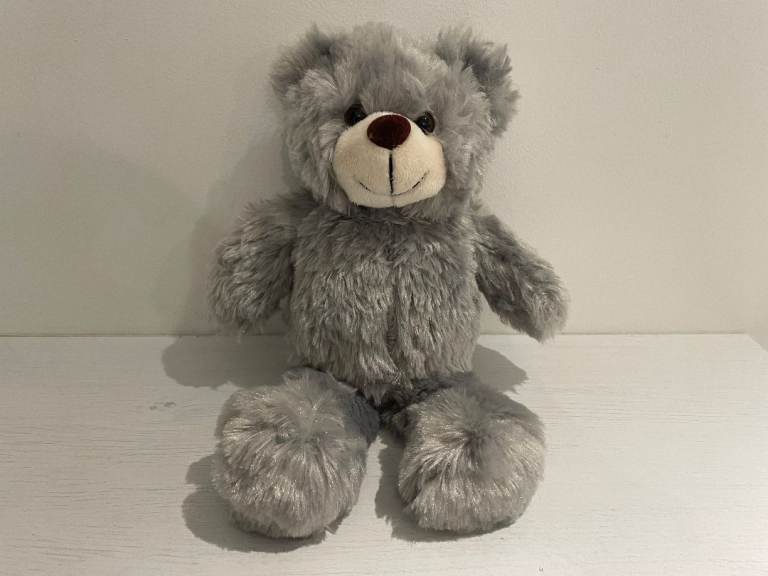 Cute grey teddy bear approximately 20 cm tall