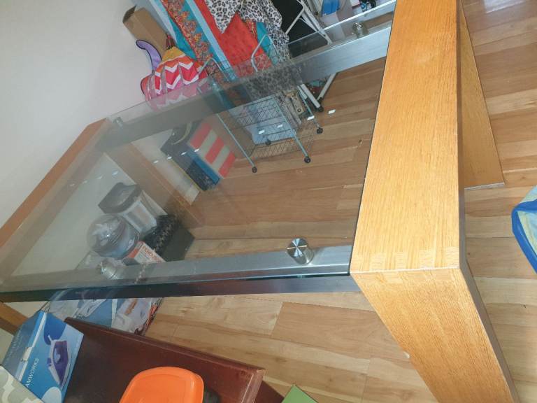 Dinning room table with glass top & heavy duty wood legs