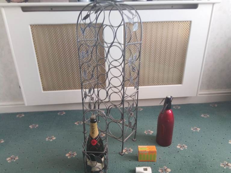 Wine rack with vintage soda syphon (with spare bulbs and attachment) 