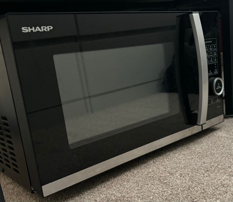 Brand New microwave/small oven with tray and different cooking options including grill
