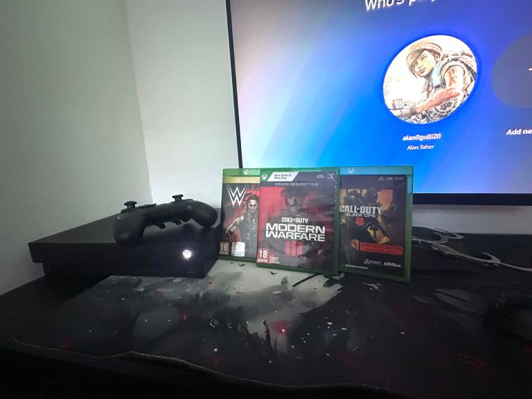 Xbox One X Console with Black Pro Controller and Games 1TB