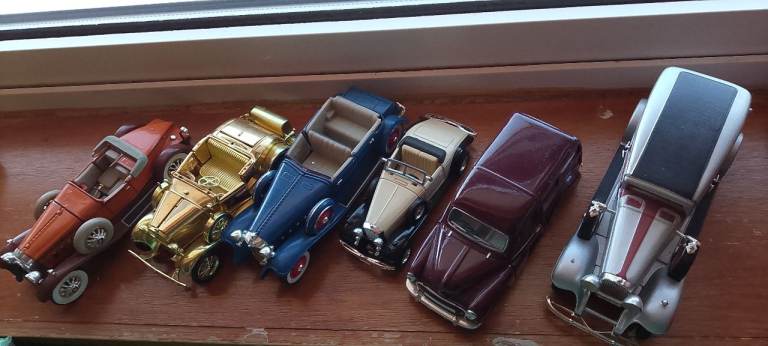 Large model car collection all been kept in cabinet 