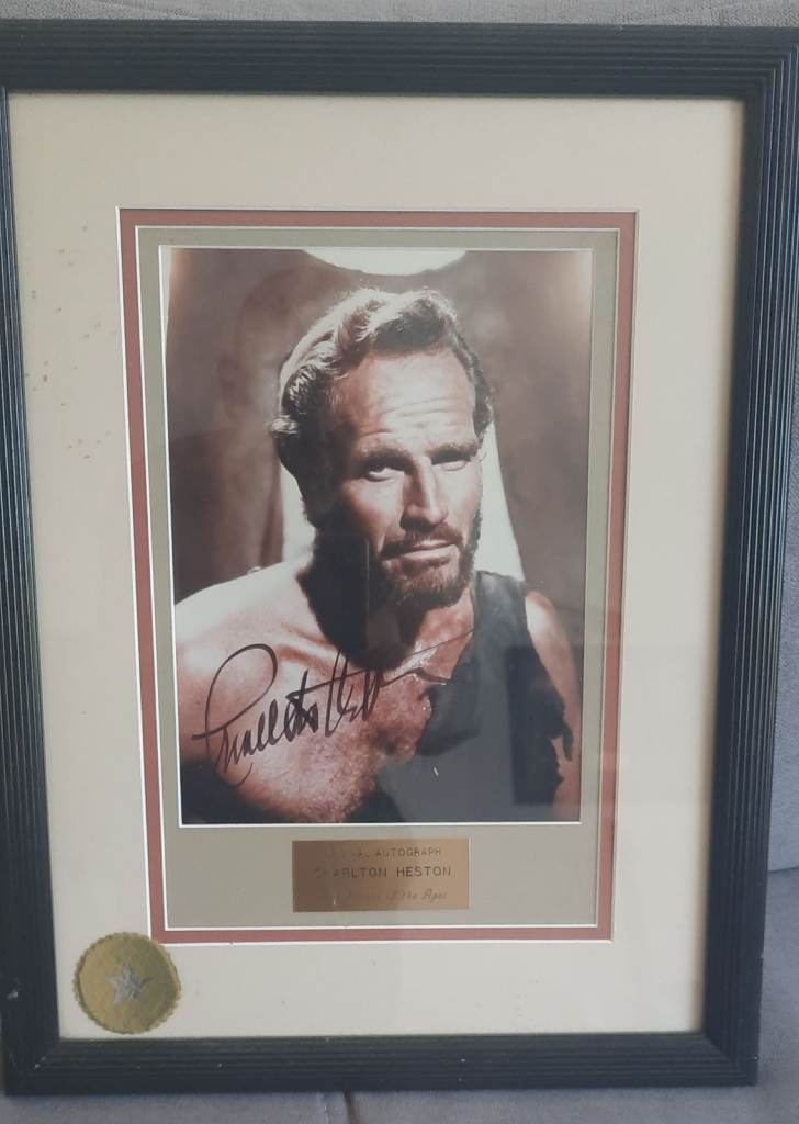 Framed photo of actor Charlton Heston from the 1968 film Planet of the Apes