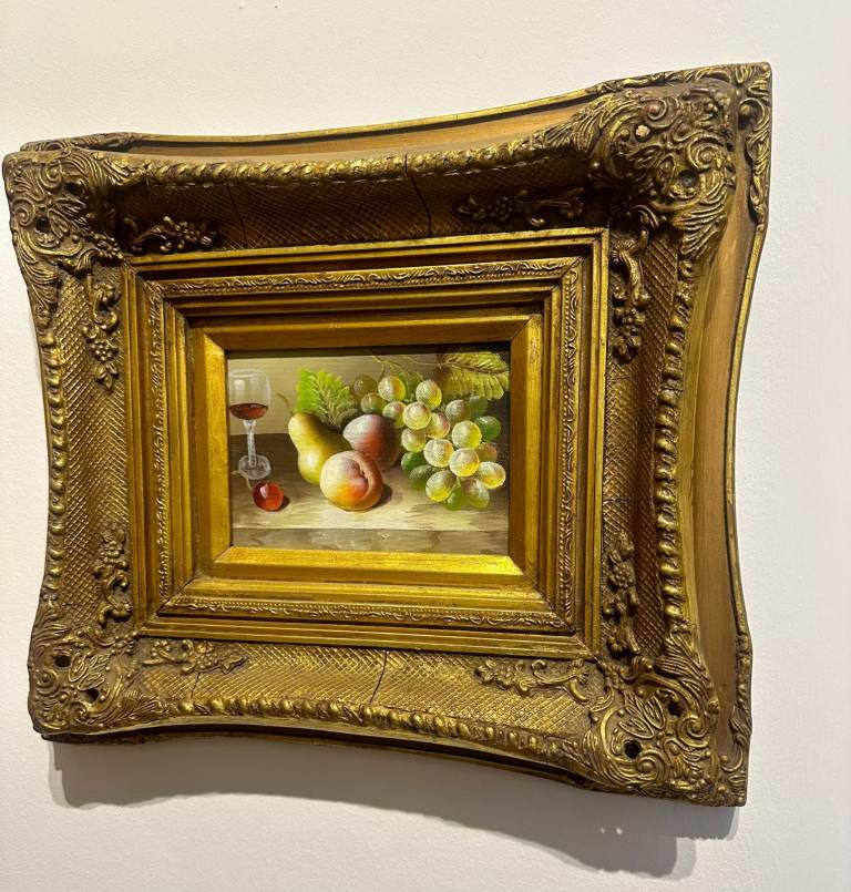 Original vintage oil still life in heavy carved gold frame. 41cm by 35cm